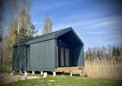 Prefabricated modular house wooden exterior dark-frontside